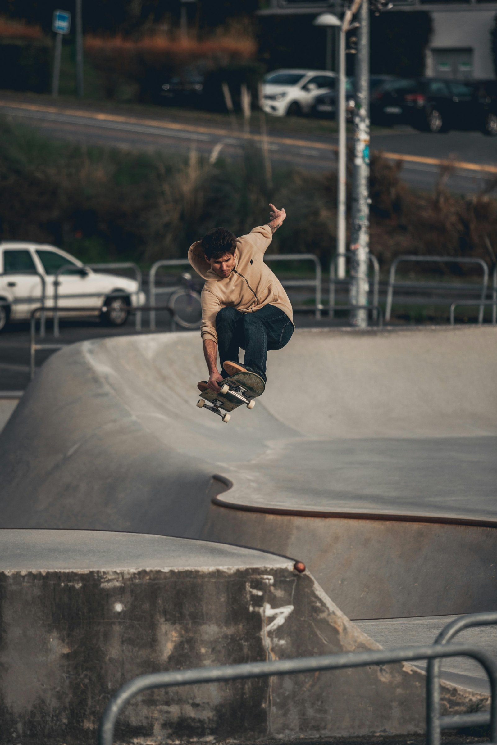 Skater floating above a concrete park transition