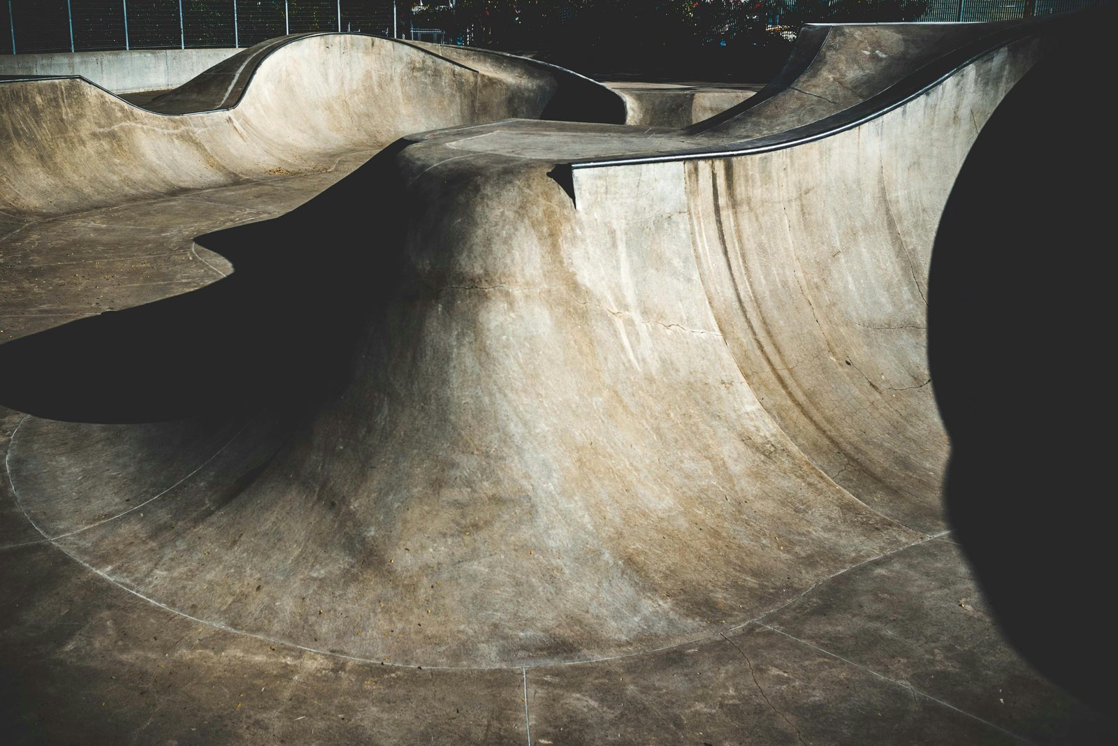 Skater filming a trick at a skatepark